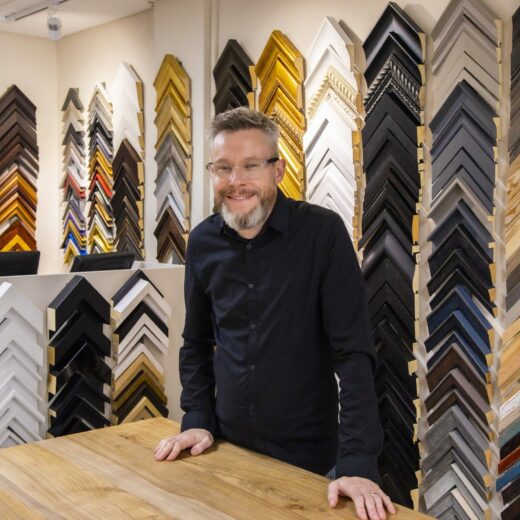 R-4-fav-scaled.jpg Picture Framing, Rob in front of the frame samples