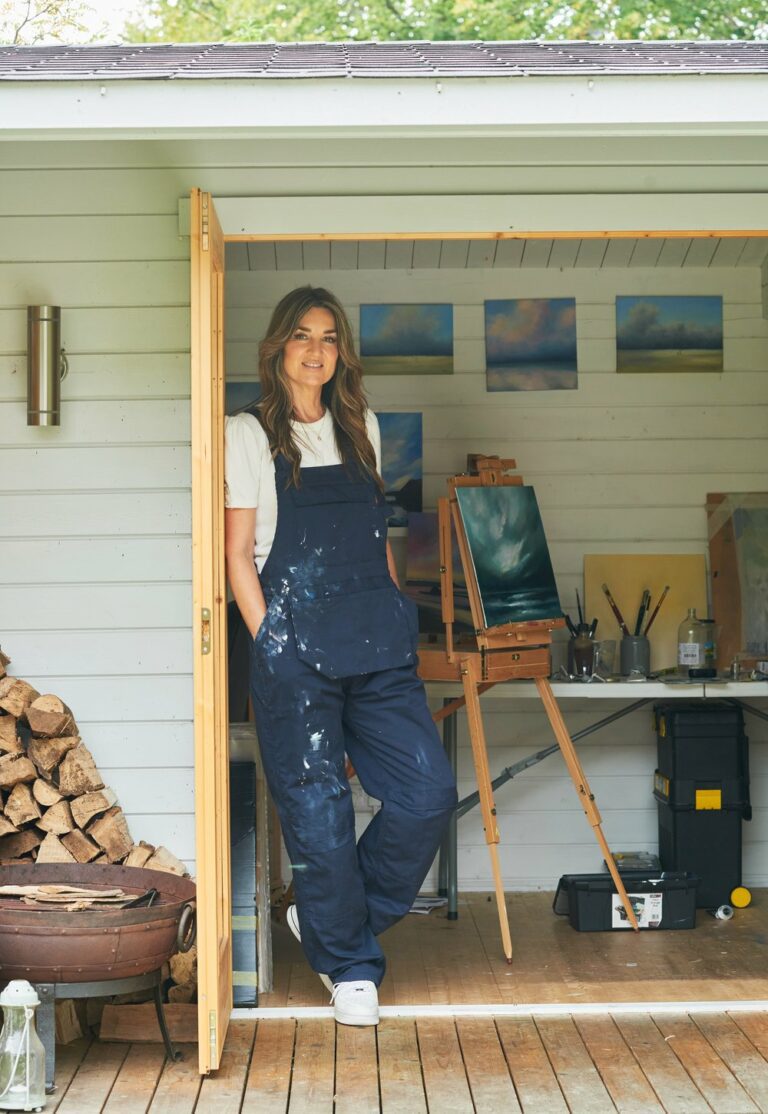 Sharon Goodenough, colour photograph of the artist standing by her studio