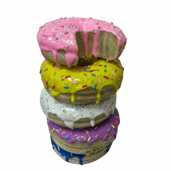 Natasha Boast, a colourful stack of resin donuts with a bite out of the top one
