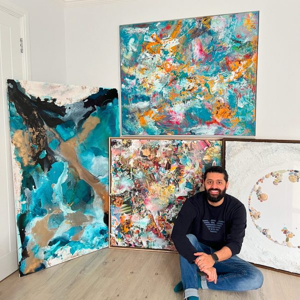 Rajan Seth, photograph of the artist surrounded by his artwork
